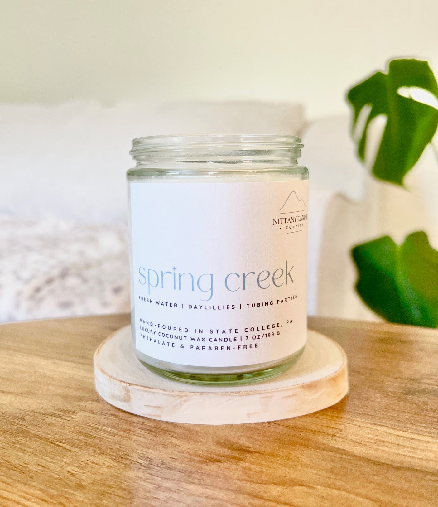 Clean-burning and nontoxic candle jar labeled 'Spring Creek'
