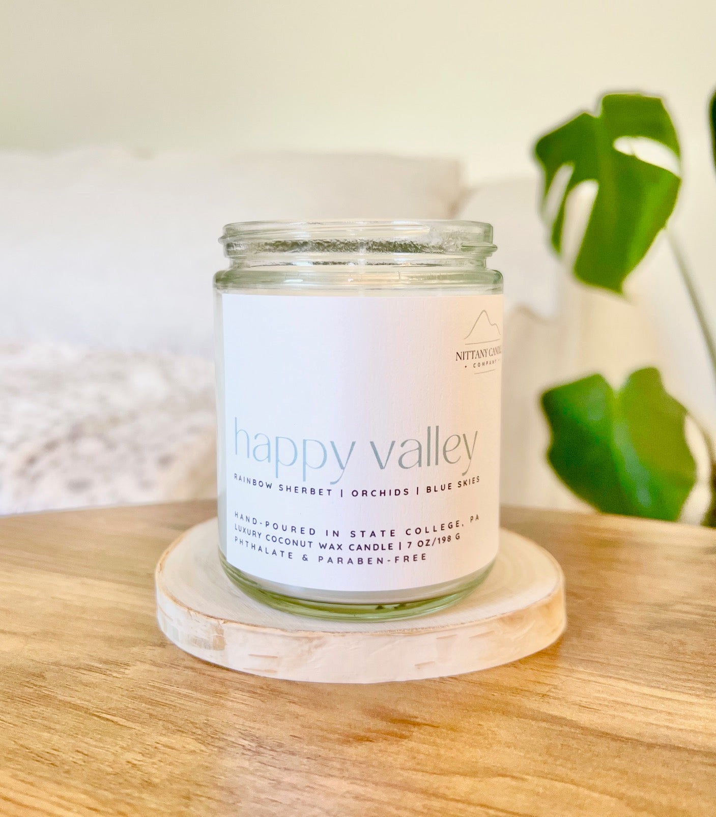 Candle jar labeled "Happy Valley" by Nittany Candle Company