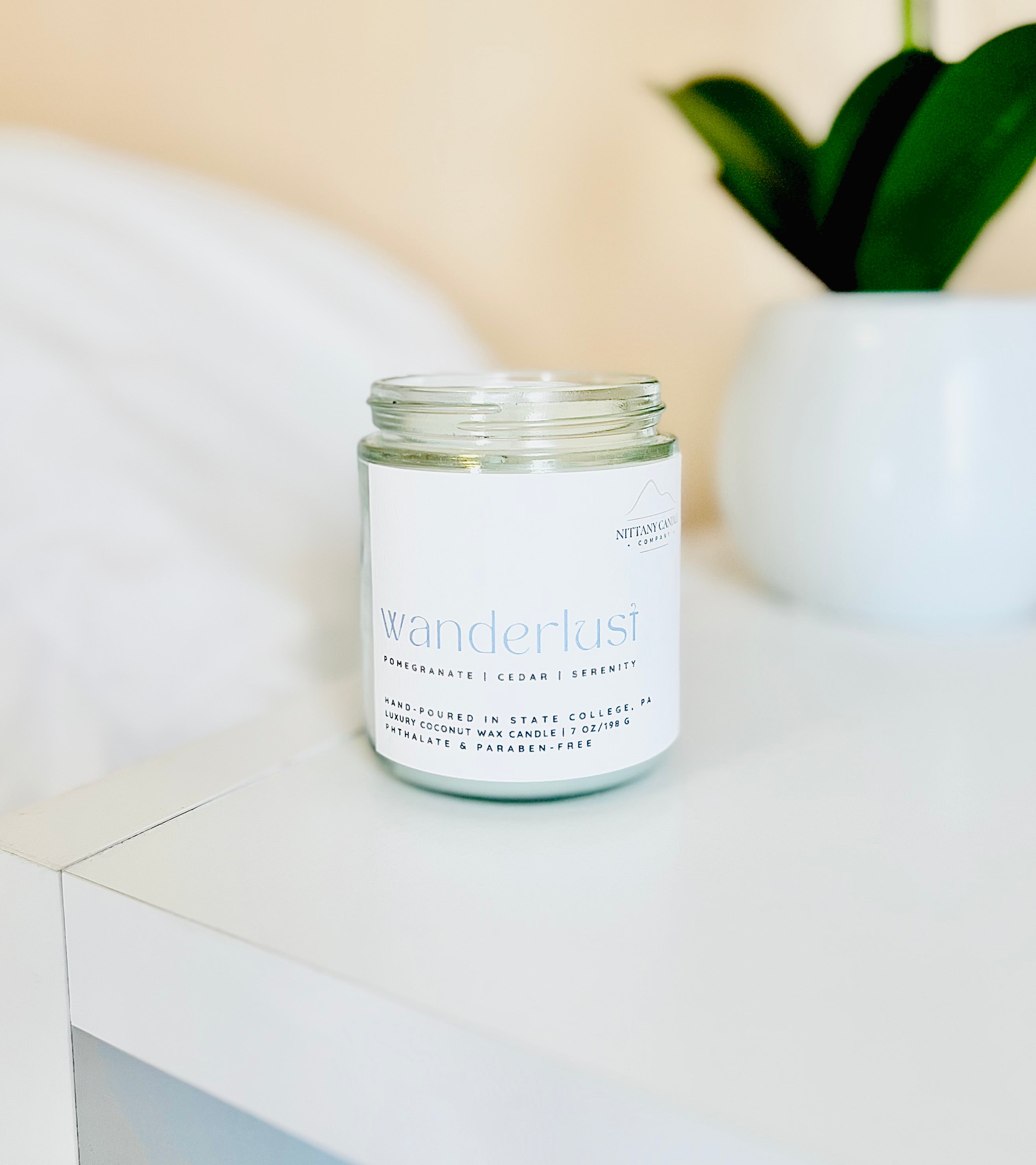Nittany Candle Company candle that smells like sandalwood and pomegranate
