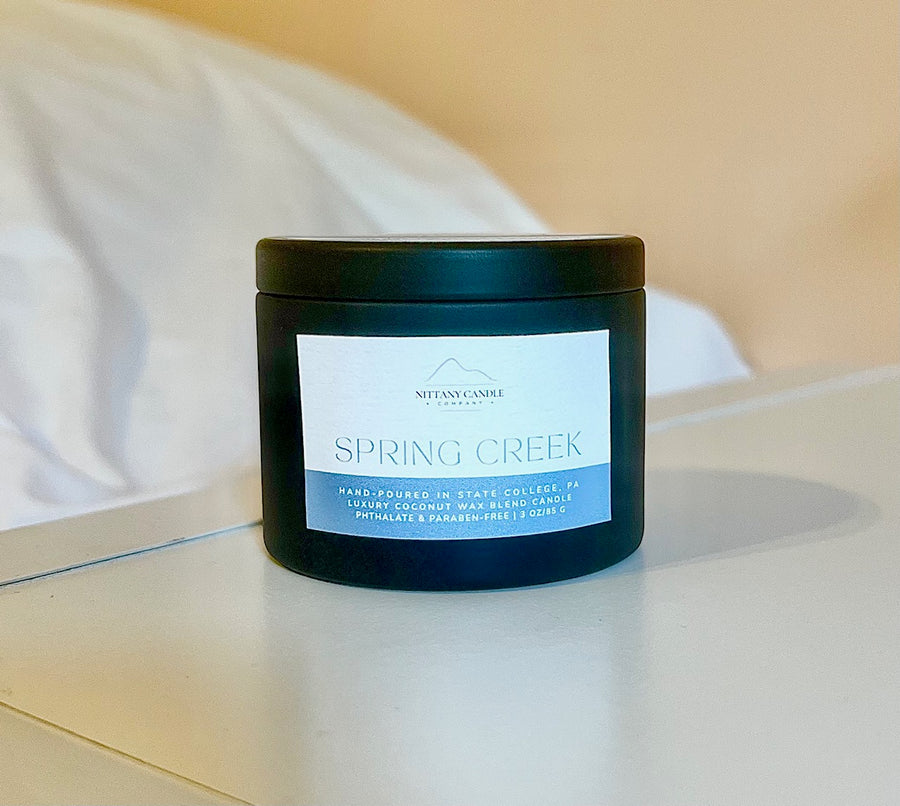Nittany Candle Company mini tin candle labeled 'spring creek'