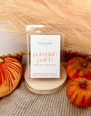 Nittany Candle Company pumpkin patch wax melt packaging with pumpkins in the background