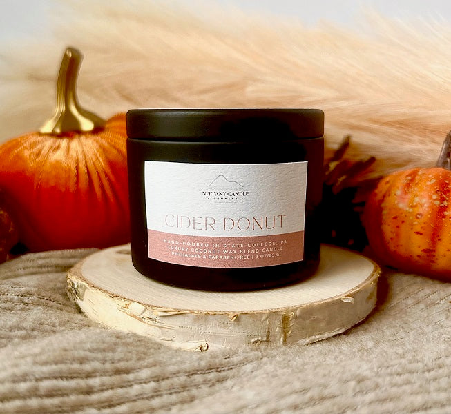 Nittany Candle Company cider donut  tin candle on fall theme display