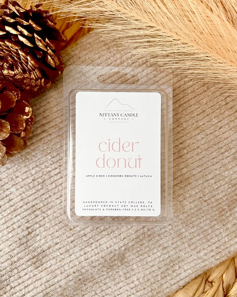 Nittany Candle Company cider donut scented wax melts on fall background