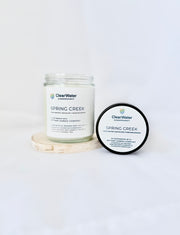 ClearWater Conservancy Spring Creek candles on a white background