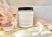 GIFT SET ITEMS INCLUDING A NITTANY CANDLE COMPANY CANDLE, A GOLD PAIR OF WICK TRIMMERS, AND A GLASS VIAL OF MATCHES WITH A HEART