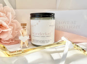 GIFT SET ITEMS INCLUDING A NITTANY CANDLE COMPANY CANDLE, A GOLD PAIR OF WICK TRIMMERS, AND A GLASS VIAL OF MATCHES WITH A HEART