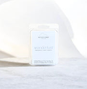 Nittany Candle Company 'wanderlust' candle packaging on a white background