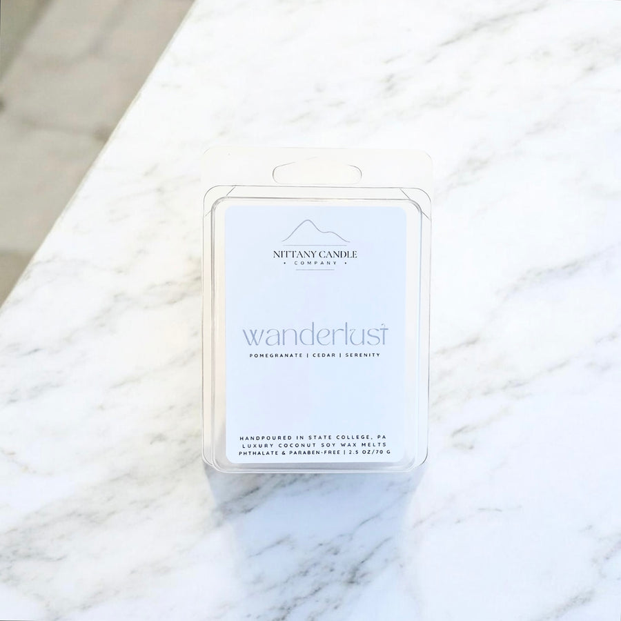 Nittany Candle Co. wax melt packaging on a marble surface